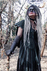 Fototapeta na wymiar Forest witch in a pine forest