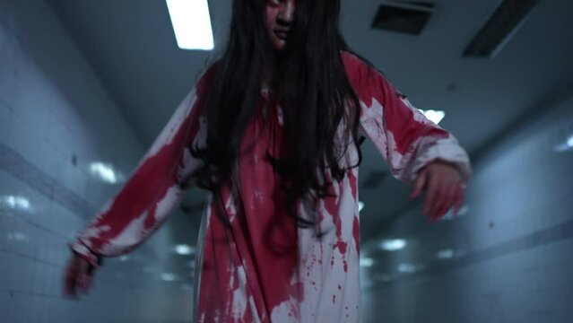 Ghost of woman in halloween concept. Zombie horror in the dark background nightmare screaming on hell is monster girl or female dead characters at night, Female with whitedress and makeup halloween.