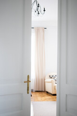 vintage white door opening into bedroom