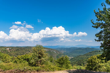 istrian landscape with blue sky and clouds near oprtalj and motovun, croatia