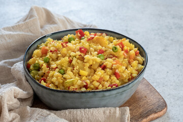 Cauliflower fried rice with vegetables corn, green peas and carrots