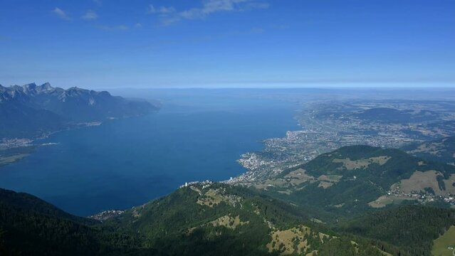 Landscape of lake, mountain and city. Time lapse of Rochers de Naye, Montreux, Switzerland. view from the top of mountain towards Lake Geneva and Montreux city in summer.
