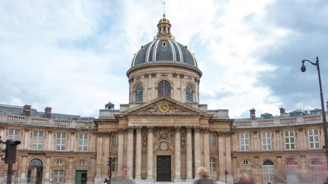 Institute de France in Paris from Pont des Arts timelapse hyperlapse. French learned society, grouping five academies, the most famous of which is the Academy francaise.