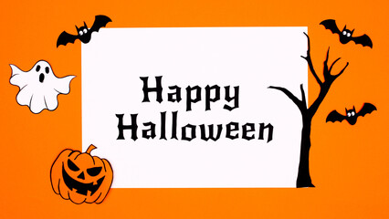 Creative Happy Halloween paper with decoration stickers on orange background. Fall holidays concept.