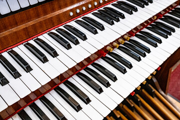 Naklejka premium keyboard of church organ in a small provincial church in central Croatia