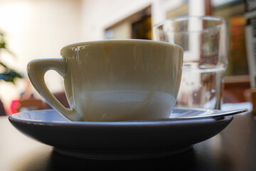 cup of coffee on a table in a restaurant, Adriatic coast, Croatia, natural lighting