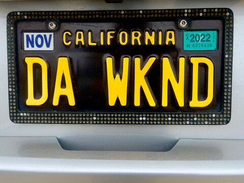 California vanity license plate text slang abbreviation DA WKND for THE WEEKEND on vehicle in public place August 14,2022 at Asilomar State Beach parking area