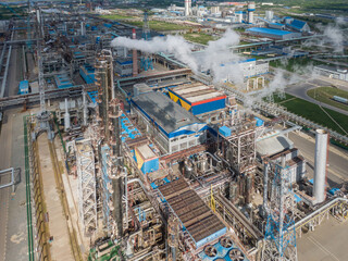Aerial view of high fractional column in chemical plant.
