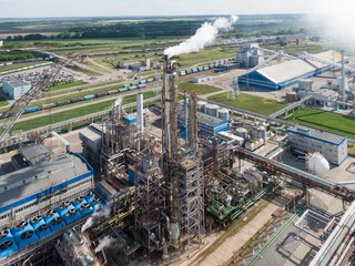 Aerial view of high fractional column in chemical plant.