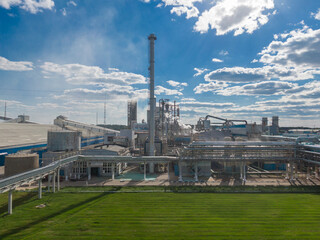 Aerial view of high fractional column in chemical plant.