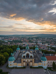 Historic church above the city in Europe at sunset