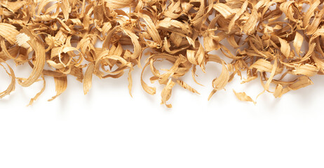 Wood shavings isolated at white background. Wooden curls on white