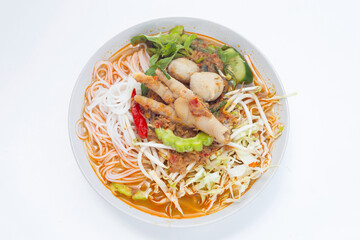 Thai rice noodle with chicken feet curry and fish balls