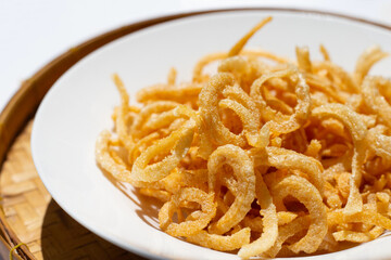 Crispy pork rinds or pork snack.