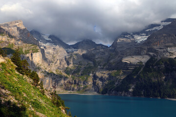 Obraz na płótnie Canvas Panoramic summer view of the Oeschinensee (Oeschinen lake) and the alps on the other side near Kandersteg, Berner Oberland, Switzerland, Europe