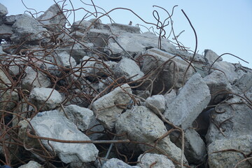 heap of concrete and iron from the demolished construction