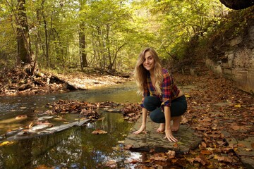 Woman in nature near creek