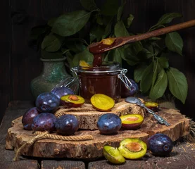 Foto op Plexiglas ripe blue plums and plum jam on the table © Natalia