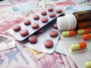       TL money pills isolated on black background. Medication costs. High costs of medicine concept. place for text    