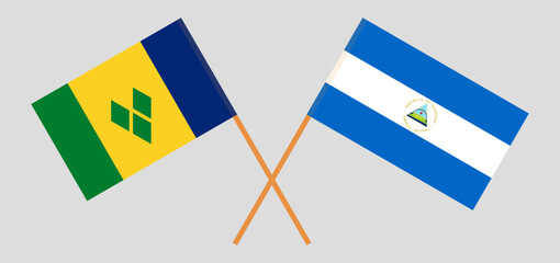Crossed flags of Saint Vincent and the Grenadines and Nicaragua. Official colors. Correct proportion