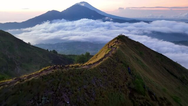 Aerial Shot Of People On Top Of Mount Batur During Vacation, Drone Flying Forward Over Volcanic Landscape - Bali, Indonesia