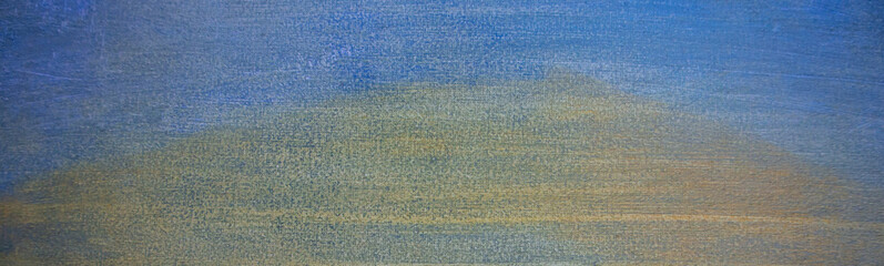 Close-up of yellow-blue oil paint on canvas. Yellow-blue background. 
