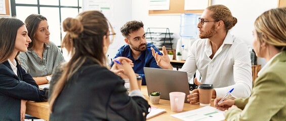 Group of business workers concentrate speaking and working at the office