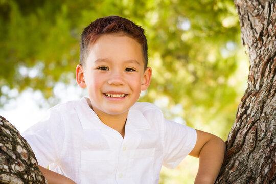 Outdoor portrait of a mixed race Chinese and Caucasian boy.