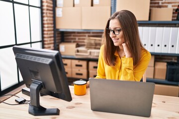 Young woman ecommerce business worker using laptop working at office