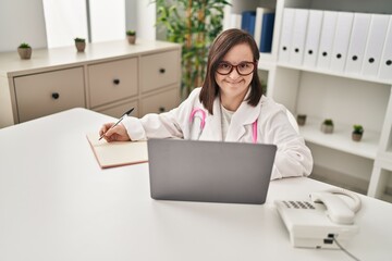 Down syndrome woman wearing doctor uniform working at clinic