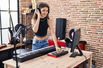 Adorable girl dj playing music session at music studio