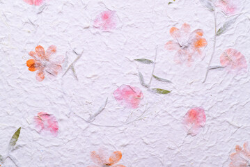 Mulberry paper sheet decorated with dry flower and leaf texture background