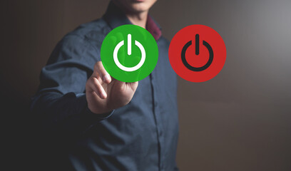 Icons for turning on and off the computer. Man tapping on the screen