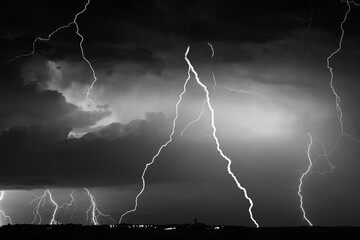 Fork lightning striking down during summer storm