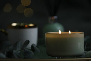 Beautiful burning candle on table, closeup. Space for text