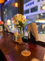 flowers with a glass of wine