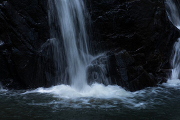 waterfall in the forest. waterfall on the rocks. water flowing over rocks. 