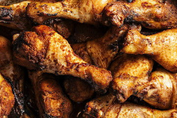 A close up of fried chicken legs, drumsticks, tasty and unhealthy food compilation. High quality photo