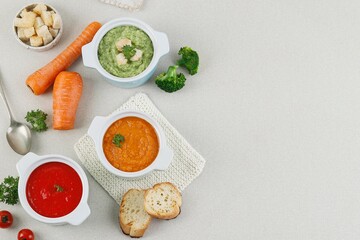 Top View Various Vegetable Soup, Broccoli, Tomato, and, Carrot Soup with Croutons and Bread. Concept Healthy Diet