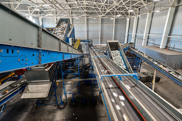 Conveyor belt transports sorted litter at recycling plant