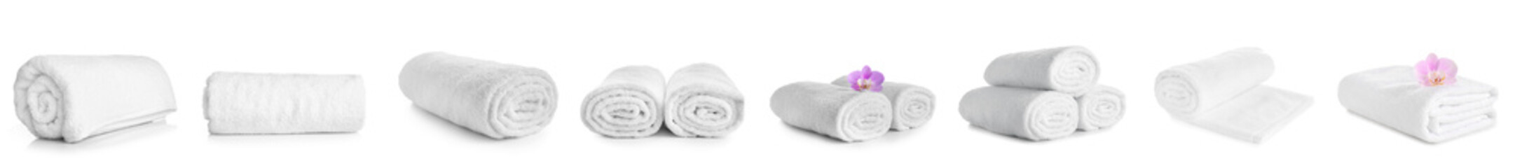 Set of clean soft towels on white background