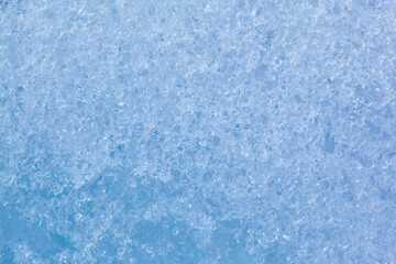 Texture of winter ice surface. Blue natural ice background