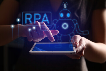 Woman using tablet computer, closeup. RPA concept