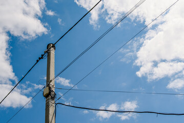 Fiber optic distribution box and electrical wires on a pole