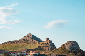 Genoese fortress on the mountain. Fortress on a high mountain. An old fort with towers on the...