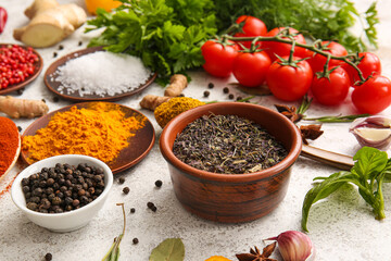 Assortment of fresh aromatic spices on light background