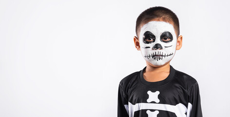 Halloween Kid. Child man horror face painting make up for ghost scary, Portrait of Asian little kid...