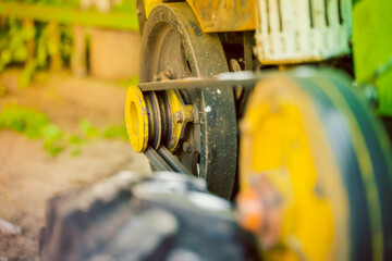 Belt drive of a garden rural motor-block. Driven two-strand pulley of a minitractor