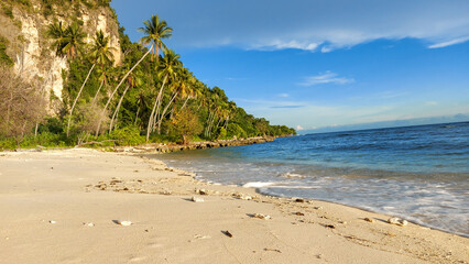 beautiful beach combination of sea waves, white sand and mountains.  Afternoon photo in the city of Gorontalo August 13, 2022
