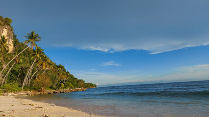 beautiful beach combination of sea waves, white sand and mountains.  Afternoon photo in the city of Gorontalo August 13, 2022